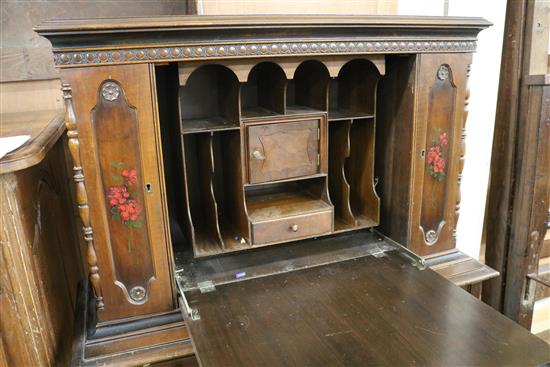 A painted and decorated secretaire cabinet W.102cm